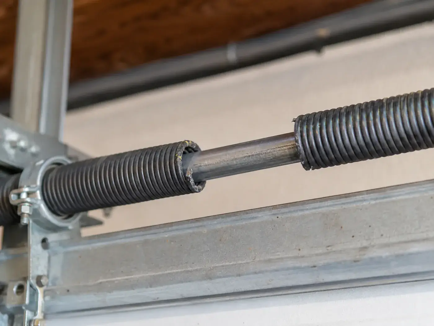 Broken garage door spring requiring professional repair